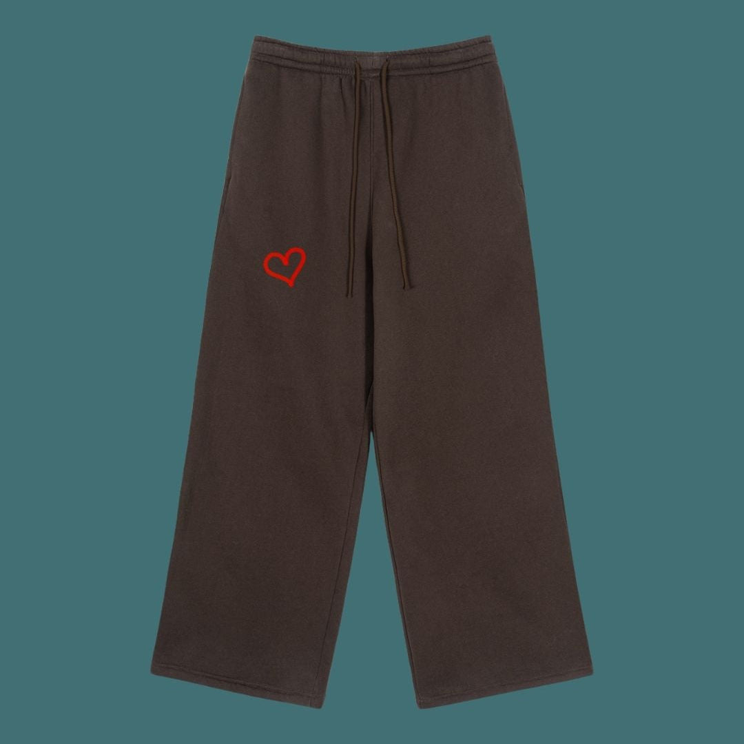 Brown pants with a red heart emblem on a teal background