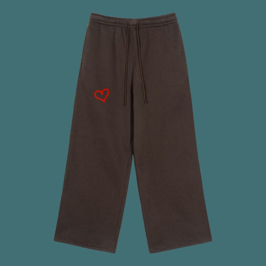 Brown pants with a red heart emblem on a teal background