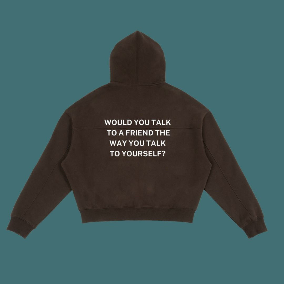Brown hoodie with text on the back against a solid background