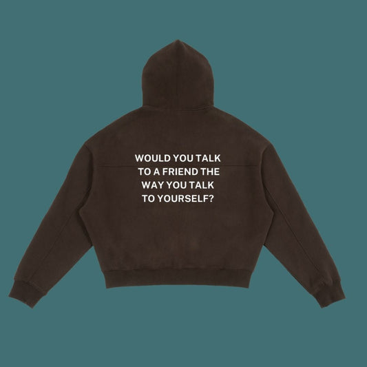 Brown hoodie with text on the back against a solid background
