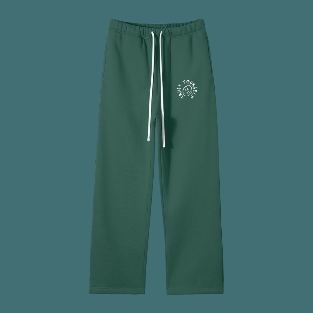 Green pants with a white logo on a solid background