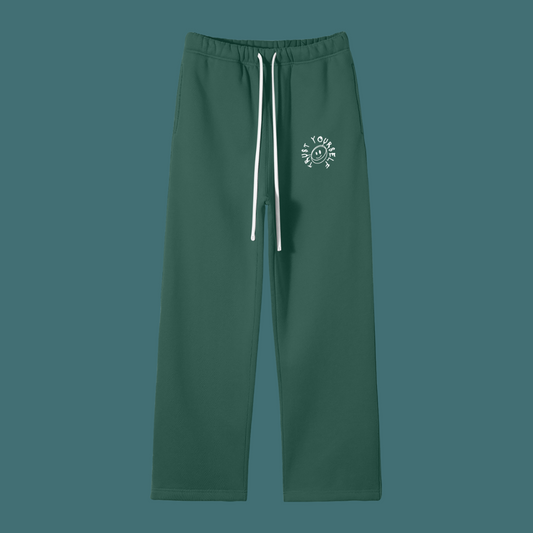 Green pants with a white logo on a solid background