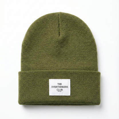 Green beanie with a label on a white background