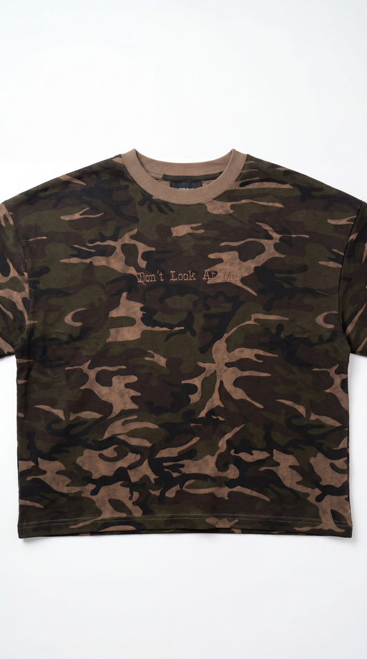 Camouflage-patterned t-shirt on a white background