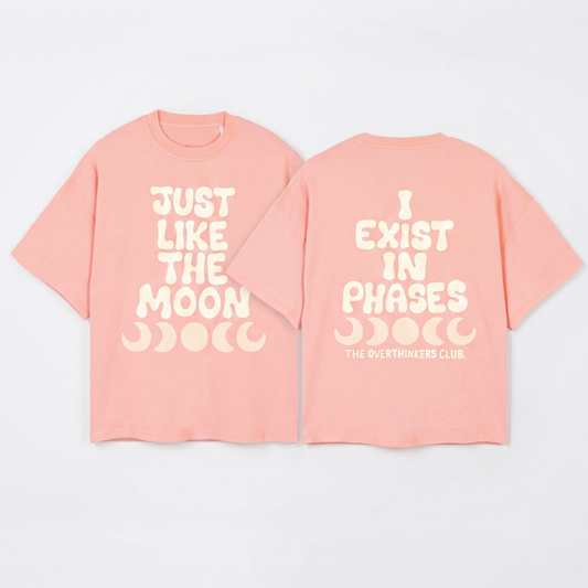 Pink t-shirt with 'Just Like The Moon' text on a white background