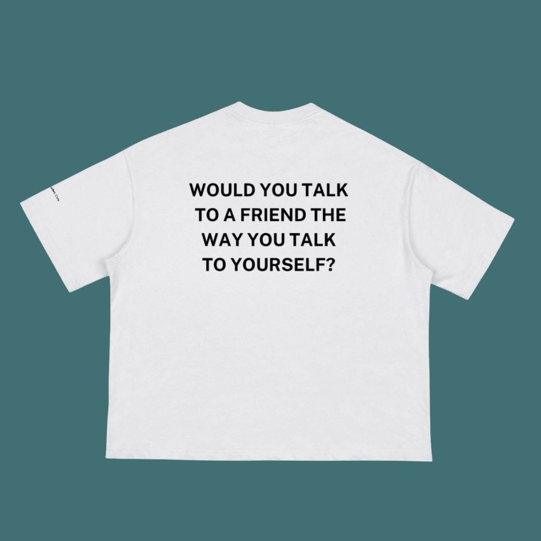White t-shirt with black text on a teal background