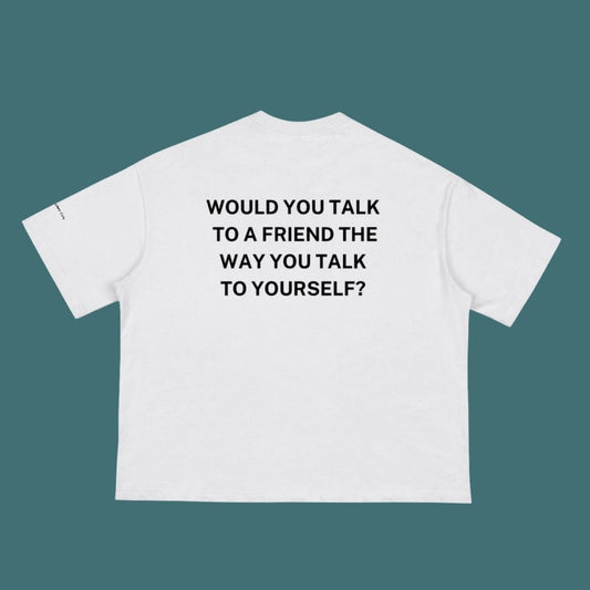 White t-shirt with black text on a teal background