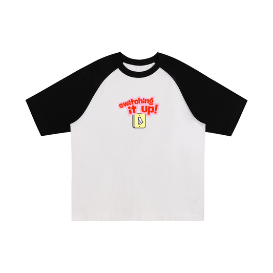 Oversized raglan t-shirt with black sleeves and a 'switching it up' light switch graphic for Pride