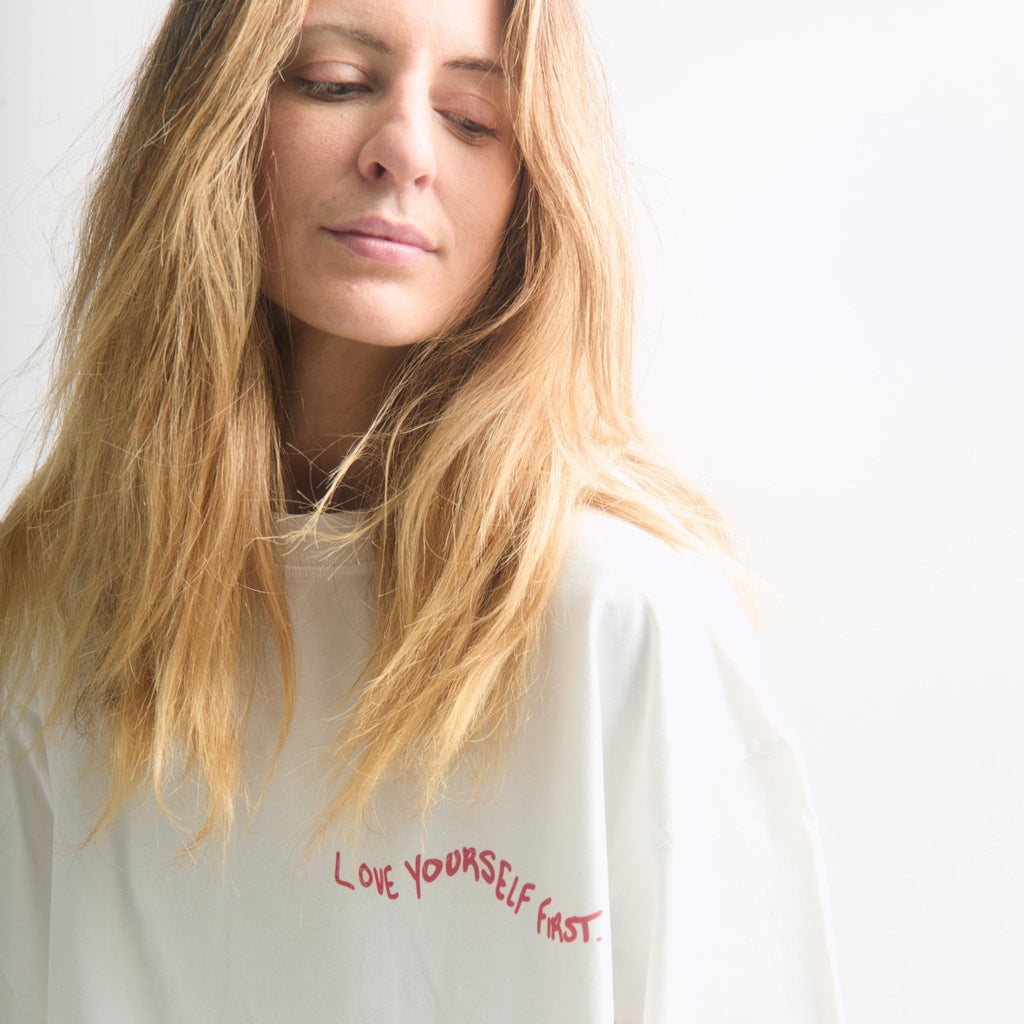 Love Yourself First Box Cut Tee — close-up of wavy graphic print | Overthinkers Club
